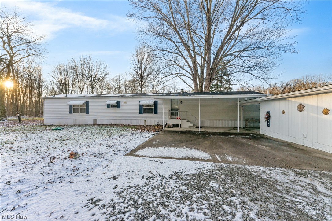 11579 Beard Road New Springfield, OH 44443 - Photo 19 of 22 Snow covered property featuring a carport