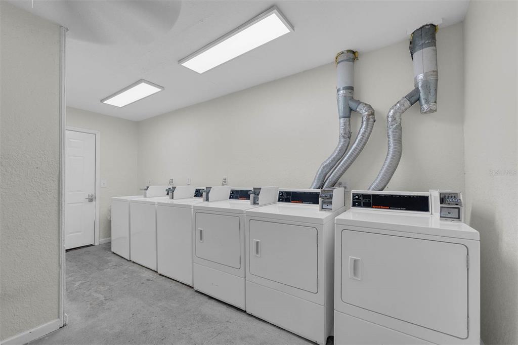 5119 Curry Ford Road, Unit 1 Orlando, FL 32812 - Photo 8 of 10 a view of a room with dryer and washer