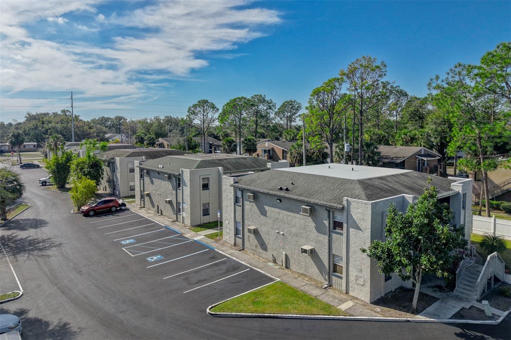 5119 Curry Ford Road, Unit 1 Orlando, FL 32812 - Photo 10 of 10 an aerial view of a house with a yard and palm trees