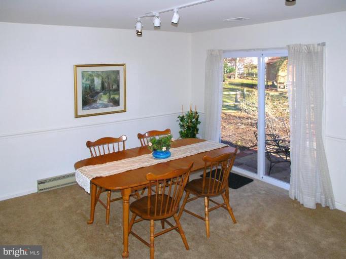 12701 Pinecrest Road Herndon, VA 20171 - Photo 2 of 30 a view of a dining room with furniture window and outside view
