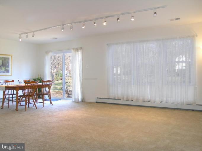 12701 Pinecrest Road Herndon, VA 20171 - Photo 13 of 30 an empty room with furniture and a window