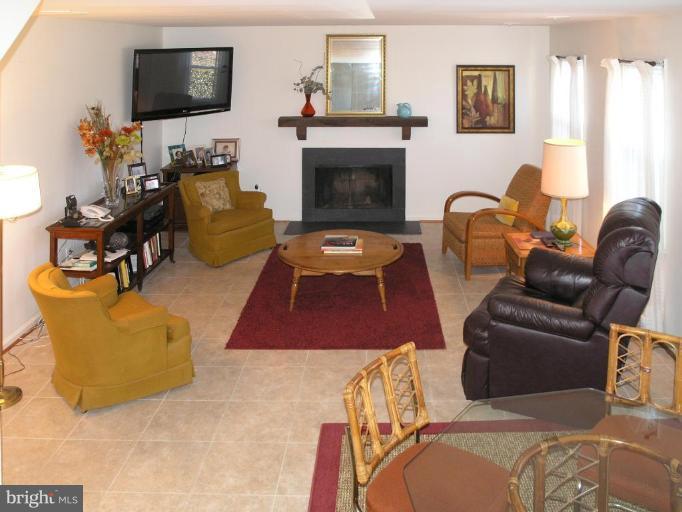 12701 Pinecrest Road Herndon, VA 20171 - Photo 15 of 30 a living room with furniture and a flat screen tv