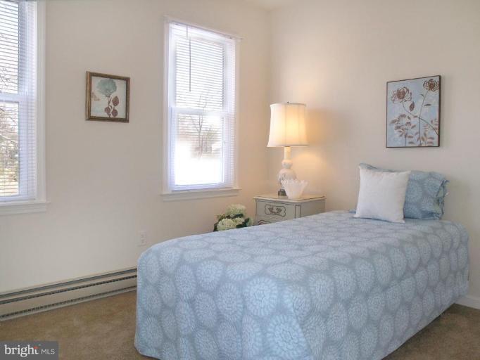 12701 Pinecrest Road Herndon, VA 20171 - Photo 21 of 30 a bedroom with a bed and a window