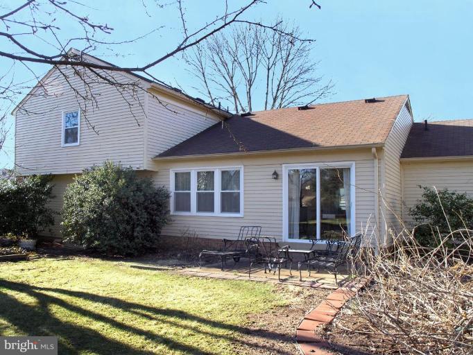 12701 Pinecrest Road Herndon, VA 20171 - Photo 22 of 30 a view of house with yard outdoor seating and covered with plants