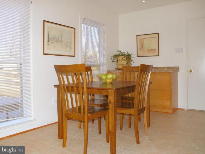 12701 Pinecrest Road Herndon, VA 20171 - Photo 4 of 30 a view of a dining room with furniture