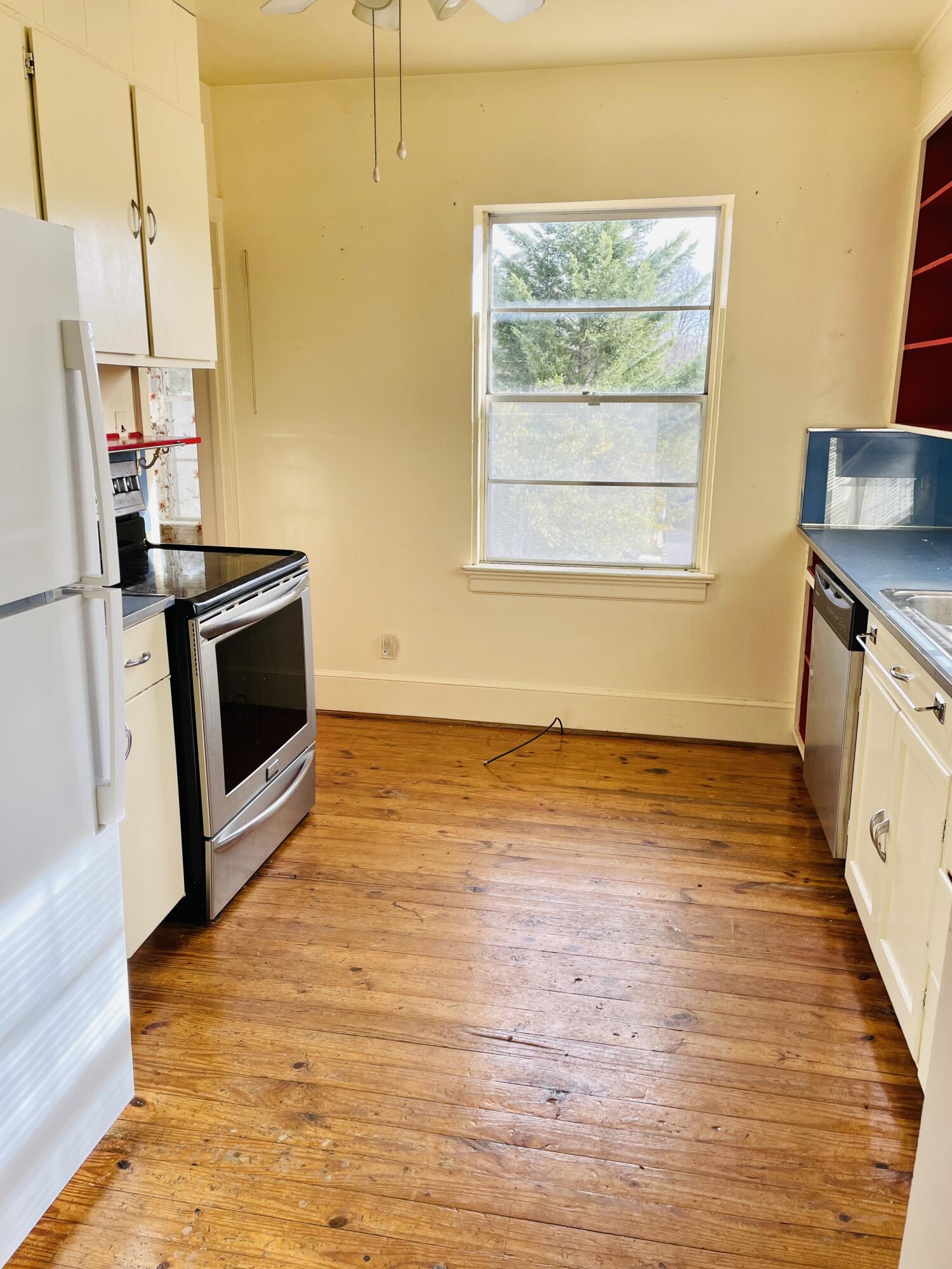 1917 Langdon Road Southwest Roanoke, VA 24015 - Photo 11 of 54 a view of a kitchen with wooden floor and electronic appliances