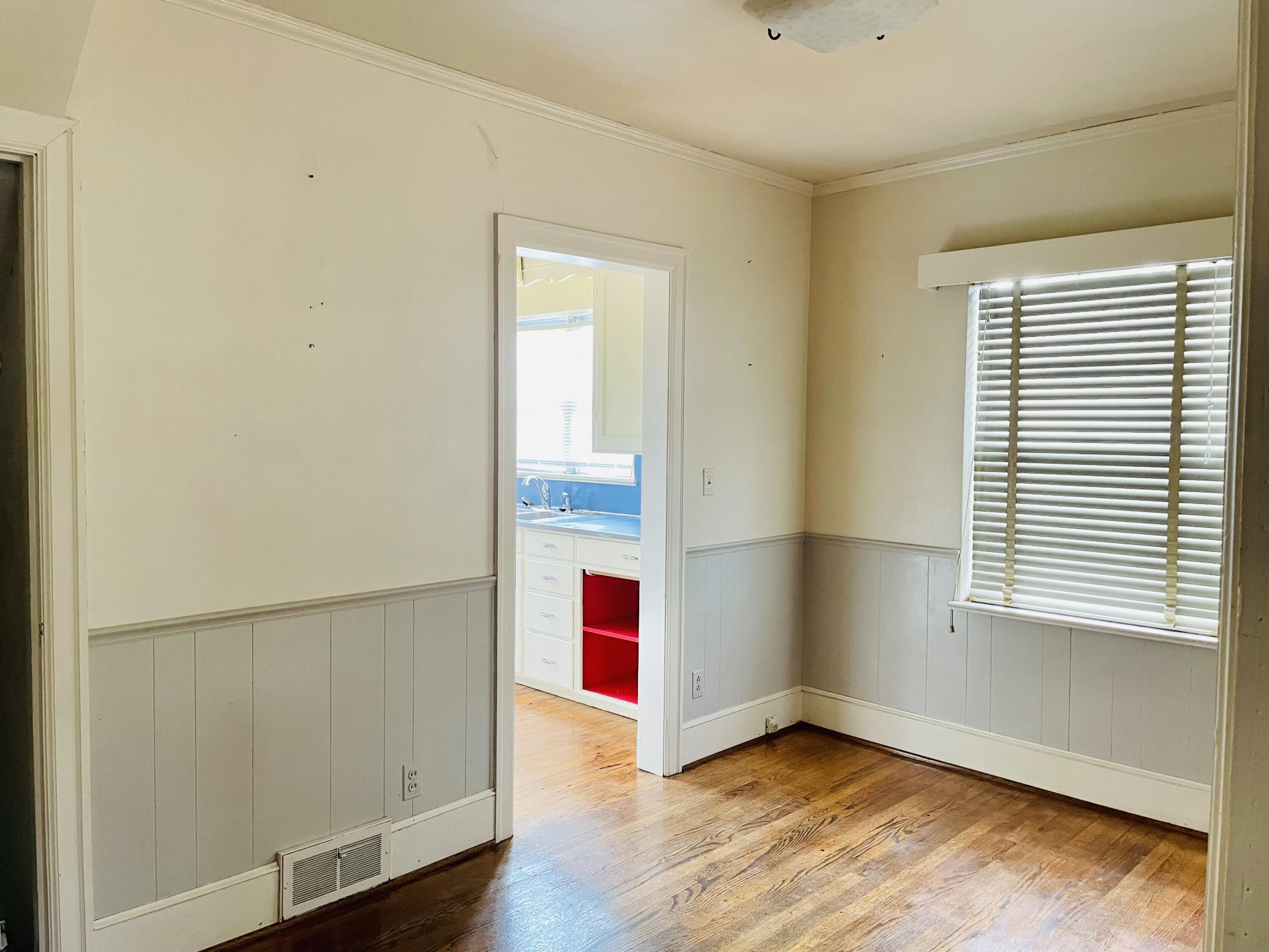 1917 Langdon Road Southwest Roanoke, VA 24015 - Photo 14 of 54 an empty room with wooden floor and windows
