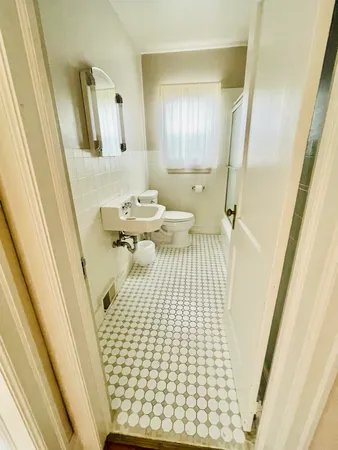 a front view of a house with a yard and a garage