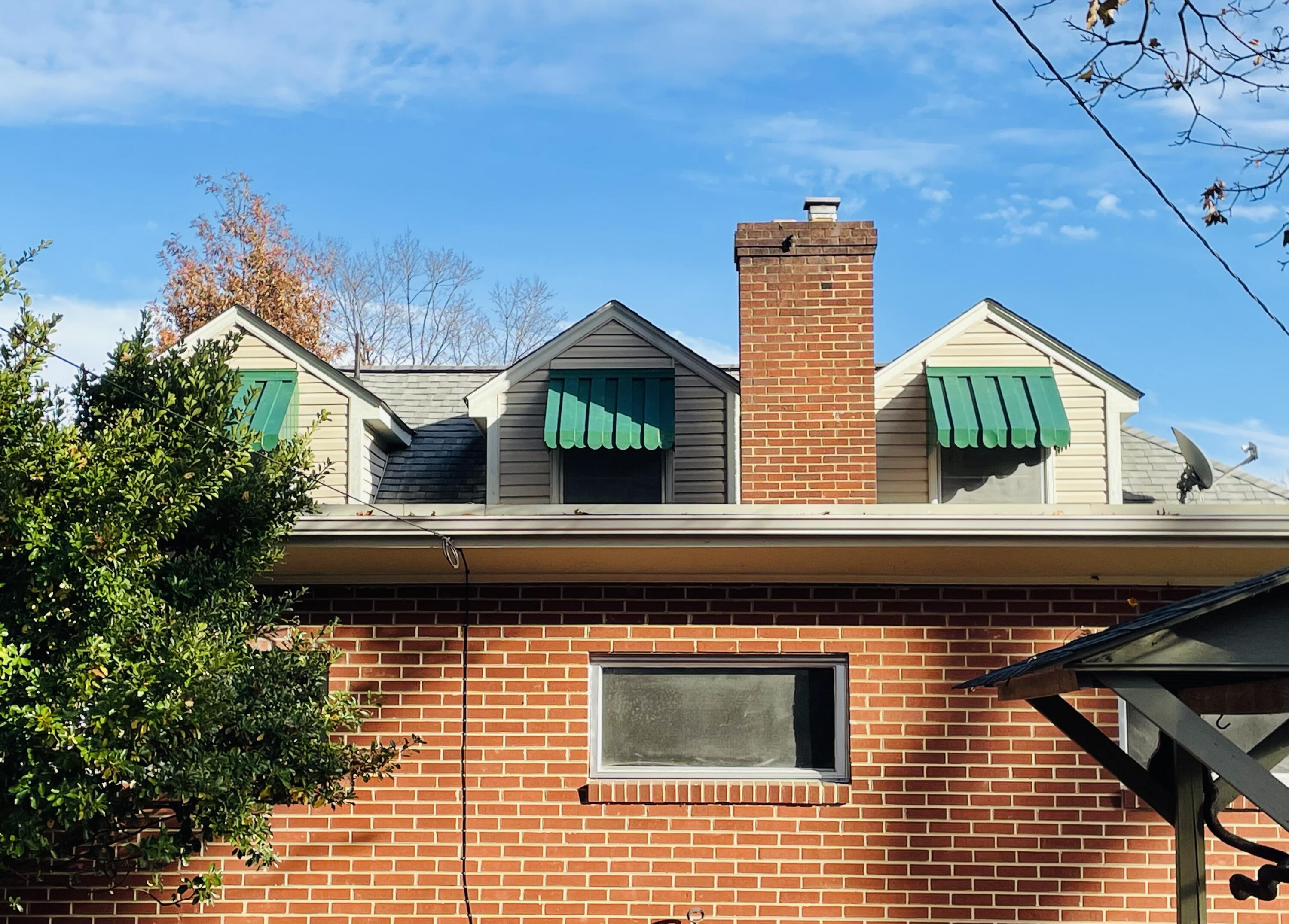 1917 Langdon Road Southwest Roanoke, VA 24015 - Photo 4 of 54 a view of a brick house with windows