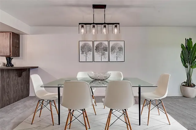 a kitchen with granite countertop a sink cabinets and window