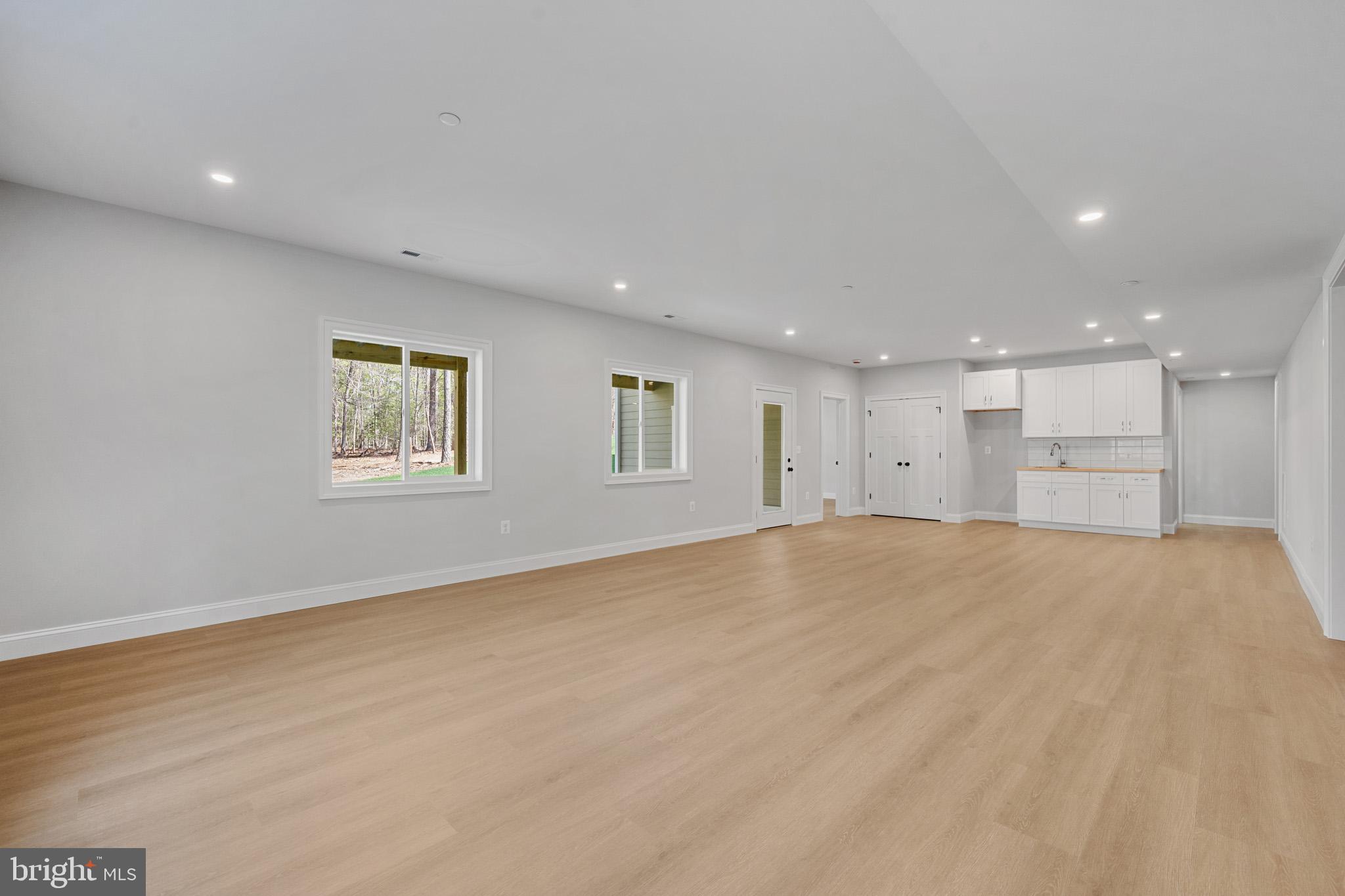3815 Watson Road Brandywine, MD 20613 - Photo 54 of 73 Rec room with lots of windows and access to patio