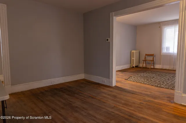 a view of an empty room and window