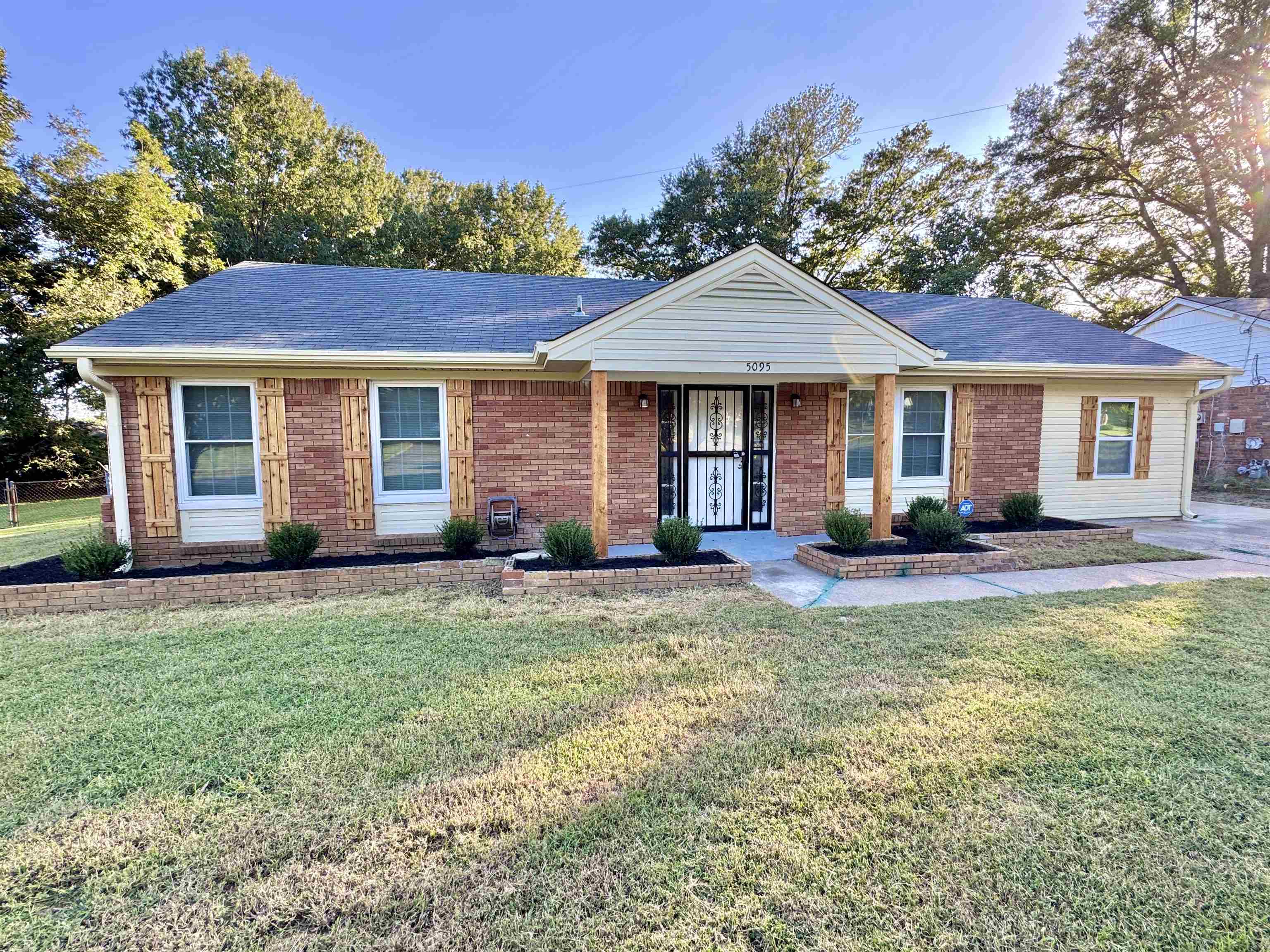 5095 Bowie Road Memphis, TN 38109 - Photo 1 of 25 Single story home featuring a front yard, brick siding, and a shingled roof