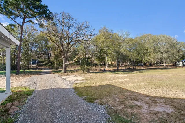 a large white kitchen with cabinets and stainless steel appliances