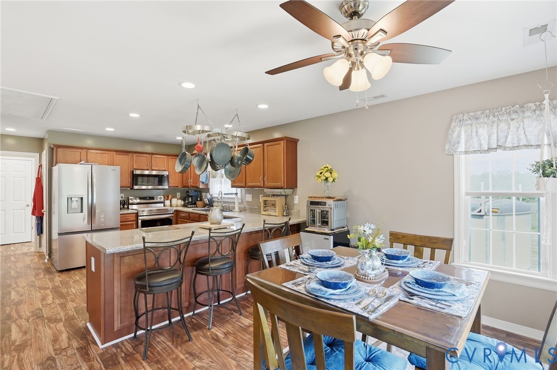 19012 Teman Road Beaverdam, VA 23015 - Photo 13 of 41 a view of a dining room with furniture and a chandelier