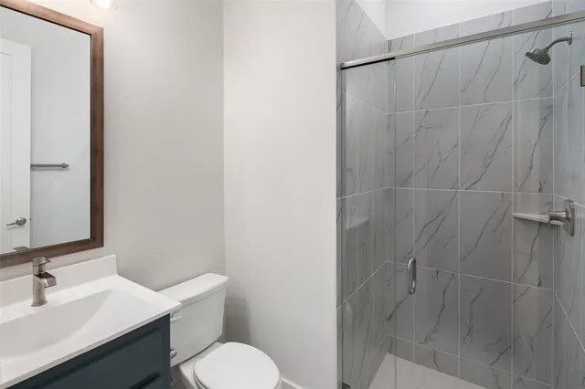 a bathroom with a sink toilet and vanity