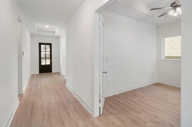 a view of a room with wooden floor
