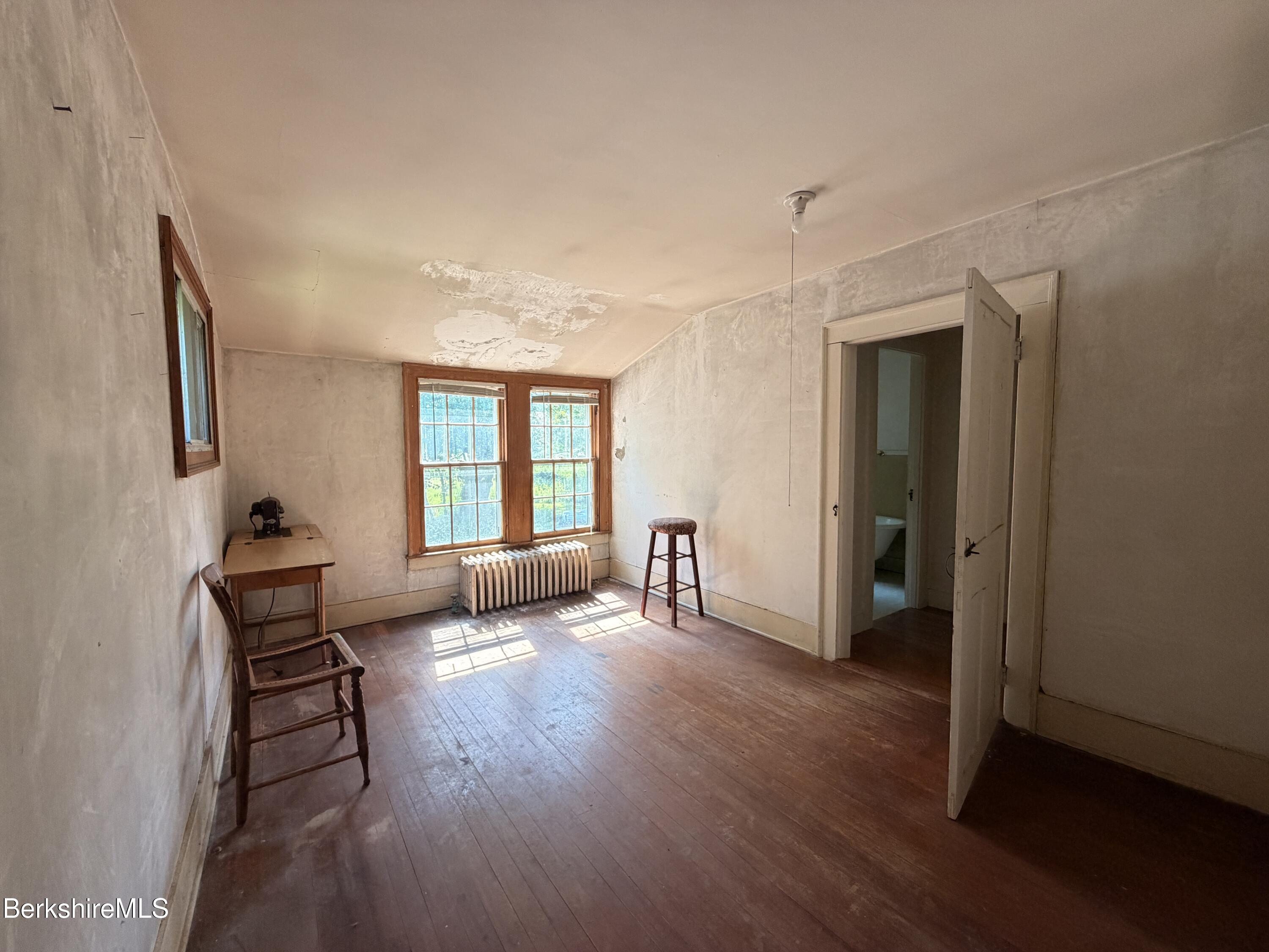 254 Main Street Sheffield, MA 01257 - Photo 11 of 13 a view of a livingroom with wooden floor and a window