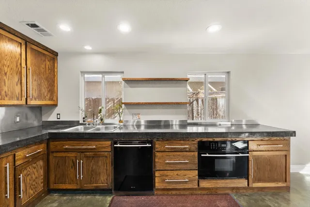 a kitchen with a stove and a sink