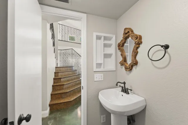 a bathroom with a sink and a mirror