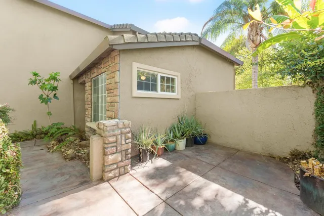 a brick house with a canopy over it