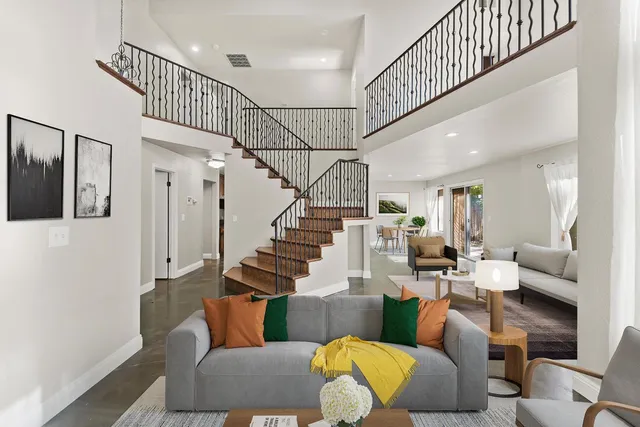 a living room with furniture or stairs and a wooden floor