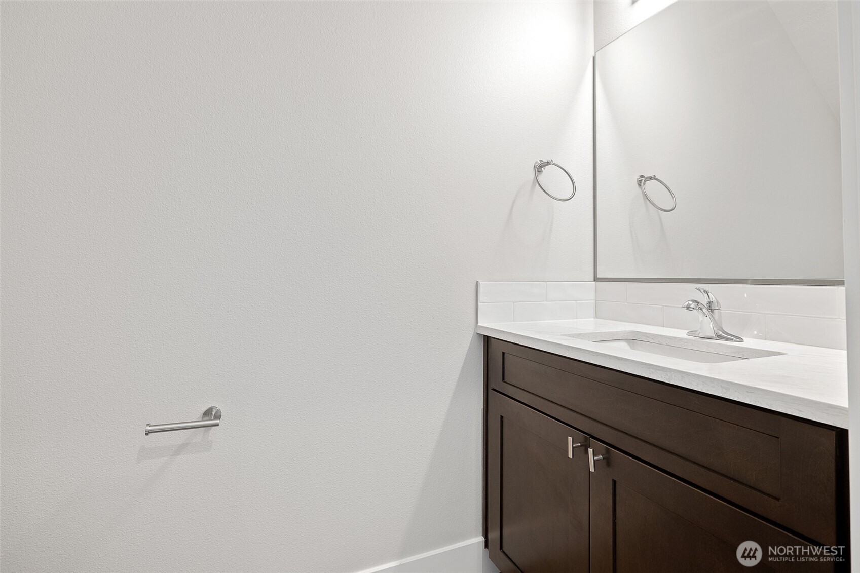 4247 Sandy Street Moses Lake, WA 98837 - Photo 12 of 26 a bathroom with a sink and a mirror