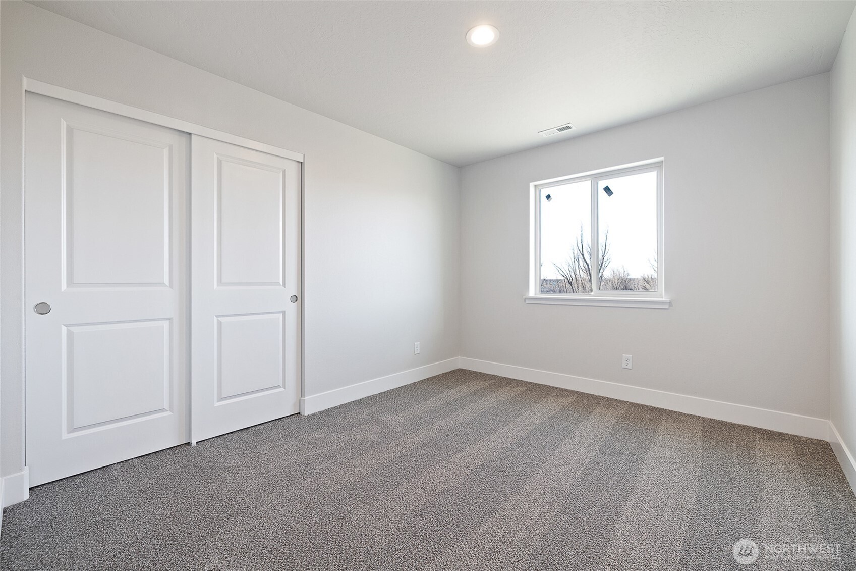 4247 Sandy Street Moses Lake, WA 98837 - Photo 17 of 26 a view of an empty room with a window