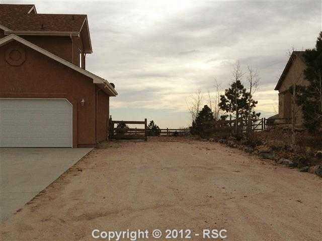 9428 Rockingham Drive Peyton, CO 80831 - Photo 2 of 17 plenty of space for motor home and ATVs to the west of the home