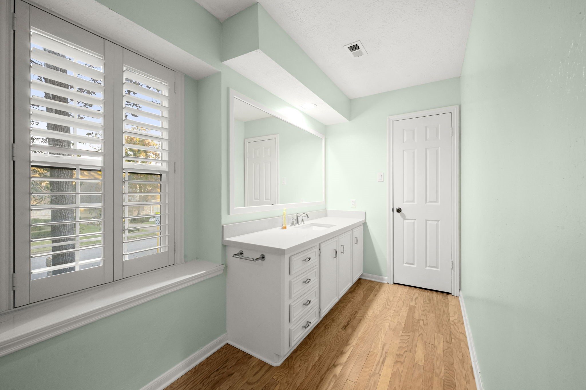 16111 Maplehurst Drive Spring, TX 77379 - Photo 21 of 30 a view of a kitchen with sink and dishwasher with wooden floor