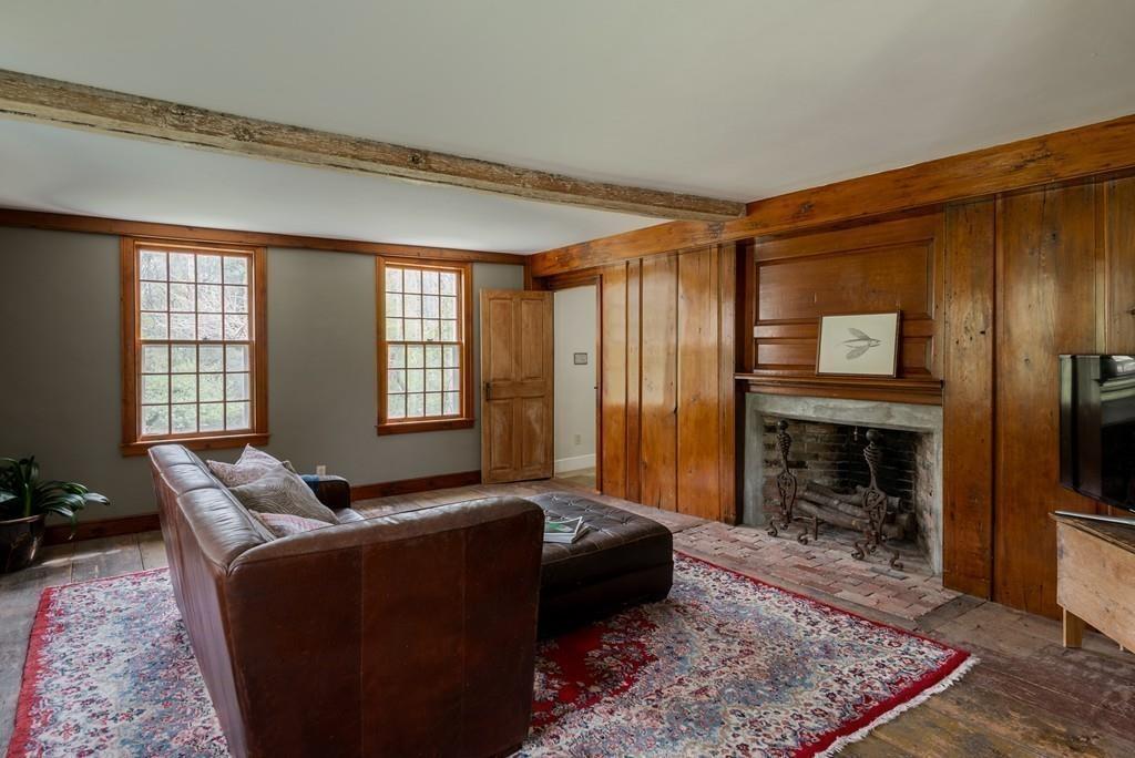 168 Argilla Road Ipswich, MA 01938 - Photo 13 of 32 a living room with furniture windows and a fireplace