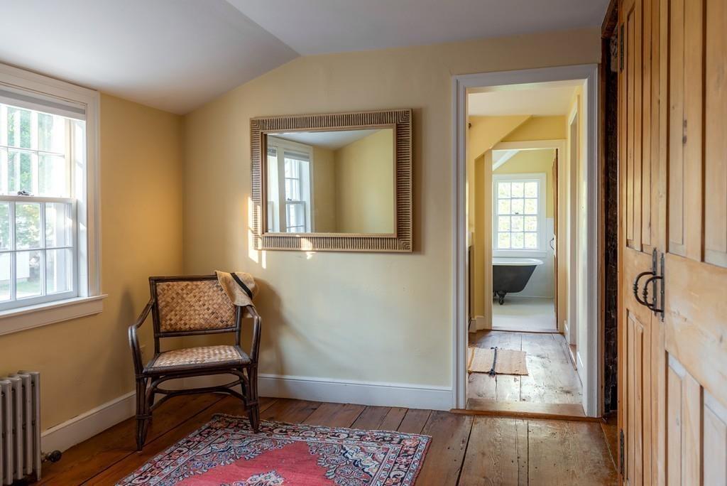 168 Argilla Road Ipswich, MA 01938 - Photo 15 of 32 a room that has a couch and a chair with wooden floor