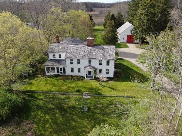 168 Argilla Road Ipswich, MA 01938 - Photo 2 of 32 an aerial view of a house with a yard table and chairs