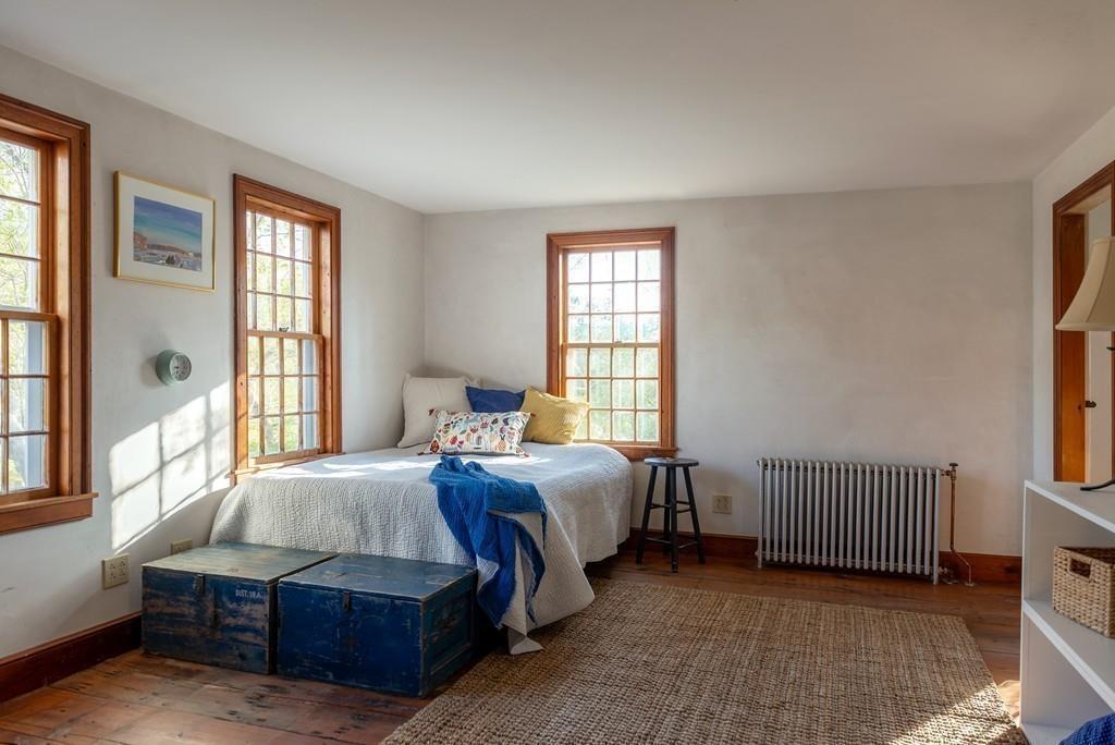168 Argilla Road Ipswich, MA 01938 - Photo 21 of 32 a bedroom with a bed and a window