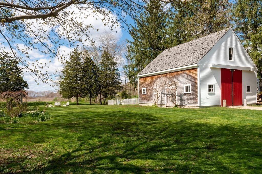 168 Argilla Road Ipswich, MA 01938 - Photo 28 of 32 a view of a yard in front of a house with large trees