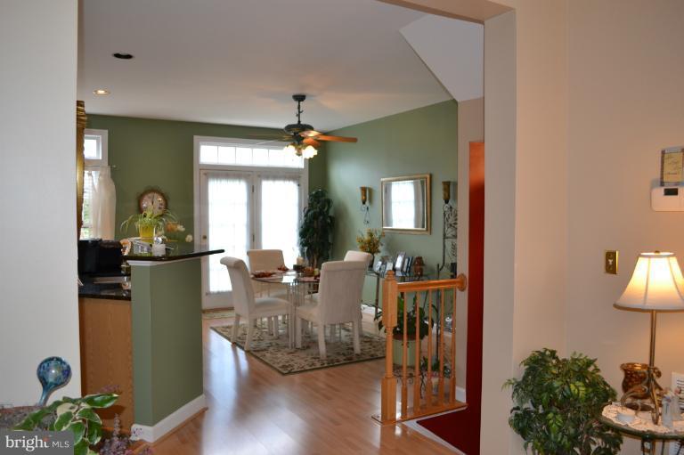 6650 Debra Lu Way Springfield, VA 22150 - Photo 2 of 25 a view of a dining room with furniture window and wooden floor