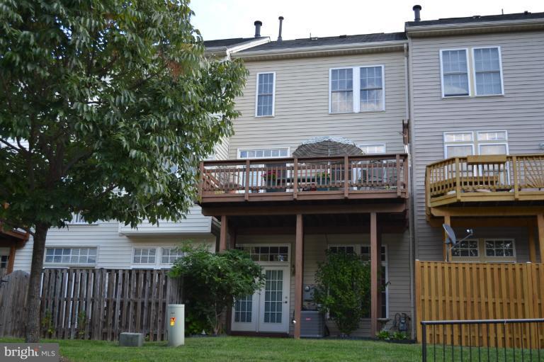 6650 Debra Lu Way Springfield, VA 22150 - Photo 11 of 25 a front view of a house with a garden
