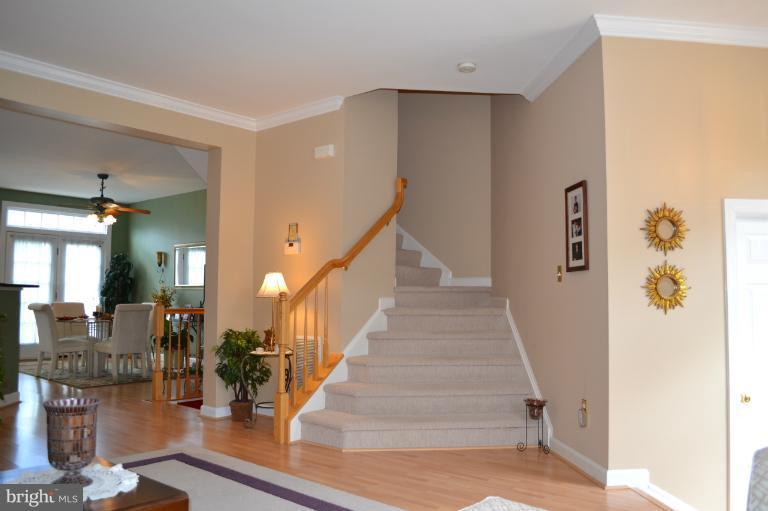 6650 Debra Lu Way Springfield, VA 22150 - Photo 16 of 25 a view of entryway and hall with wooden floor