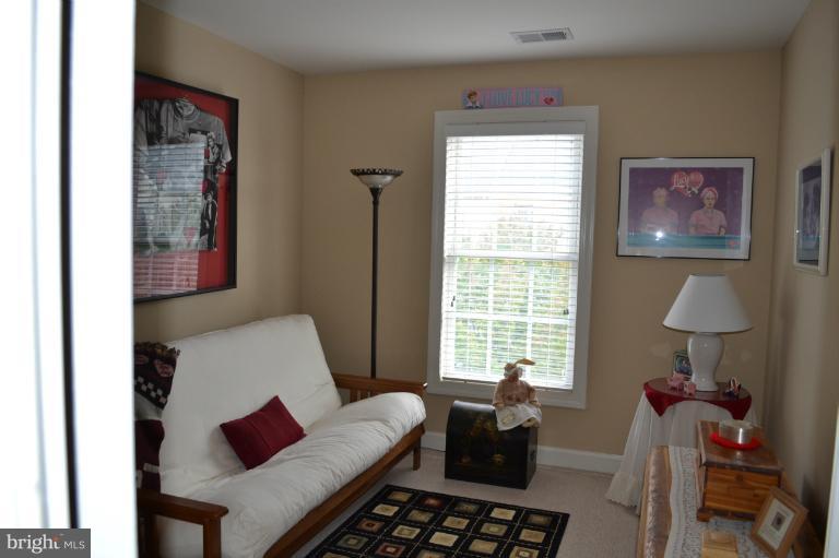 6650 Debra Lu Way Springfield, VA 22150 - Photo 17 of 25 a living room with furniture and a window