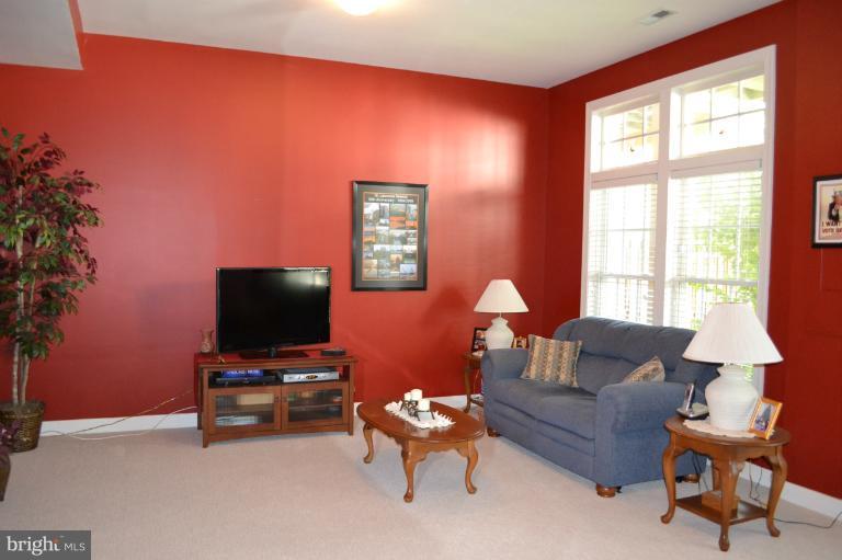 6650 Debra Lu Way Springfield, VA 22150 - Photo 18 of 25 a living room with furniture and a flat screen tv