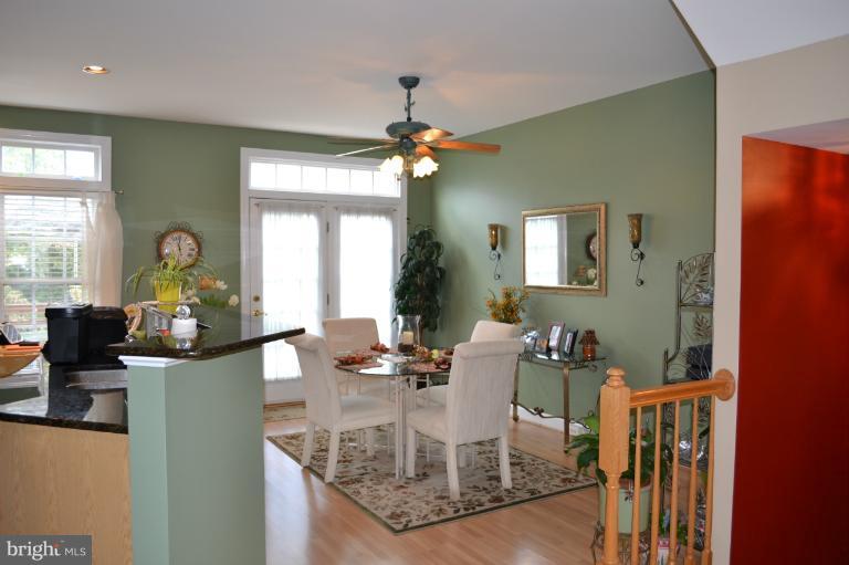 6650 Debra Lu Way Springfield, VA 22150 - Photo 19 of 25 a view of a dining room with furniture and a chandelier