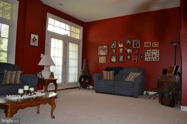6650 Debra Lu Way Springfield, VA 22150 - Photo 8 of 25 a living room with furniture and a window