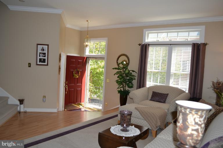 6650 Debra Lu Way Springfield, VA 22150 - Photo 9 of 25 a living room with furniture and a large window