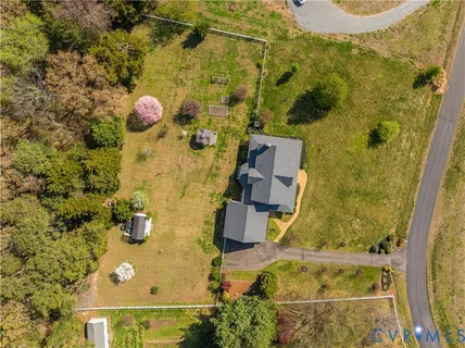 an aerial view of residential house with an outdoor space