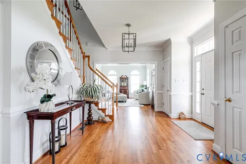 a view of an entryway with wooden floor