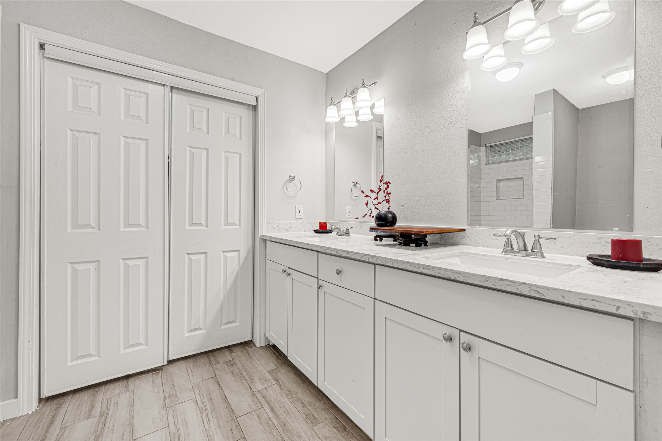 5009 Bataan Road Houston, TX 77033 - Photo 21 of 24 a bathroom with a double vanity sink and a mirror