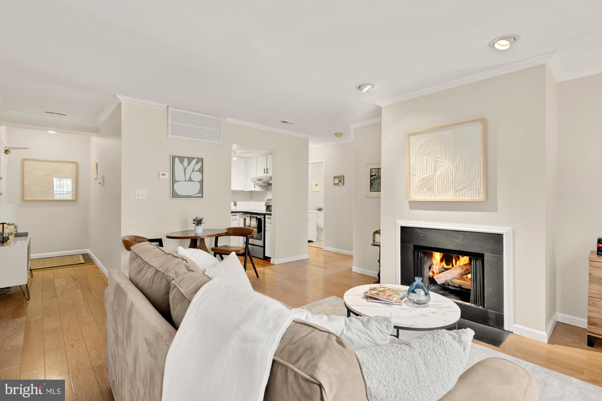 a bedroom with furniture and a fireplace