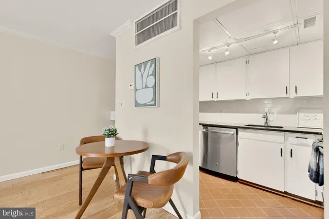 a kitchen with stainless steel appliances granite countertop a sink and cabinets