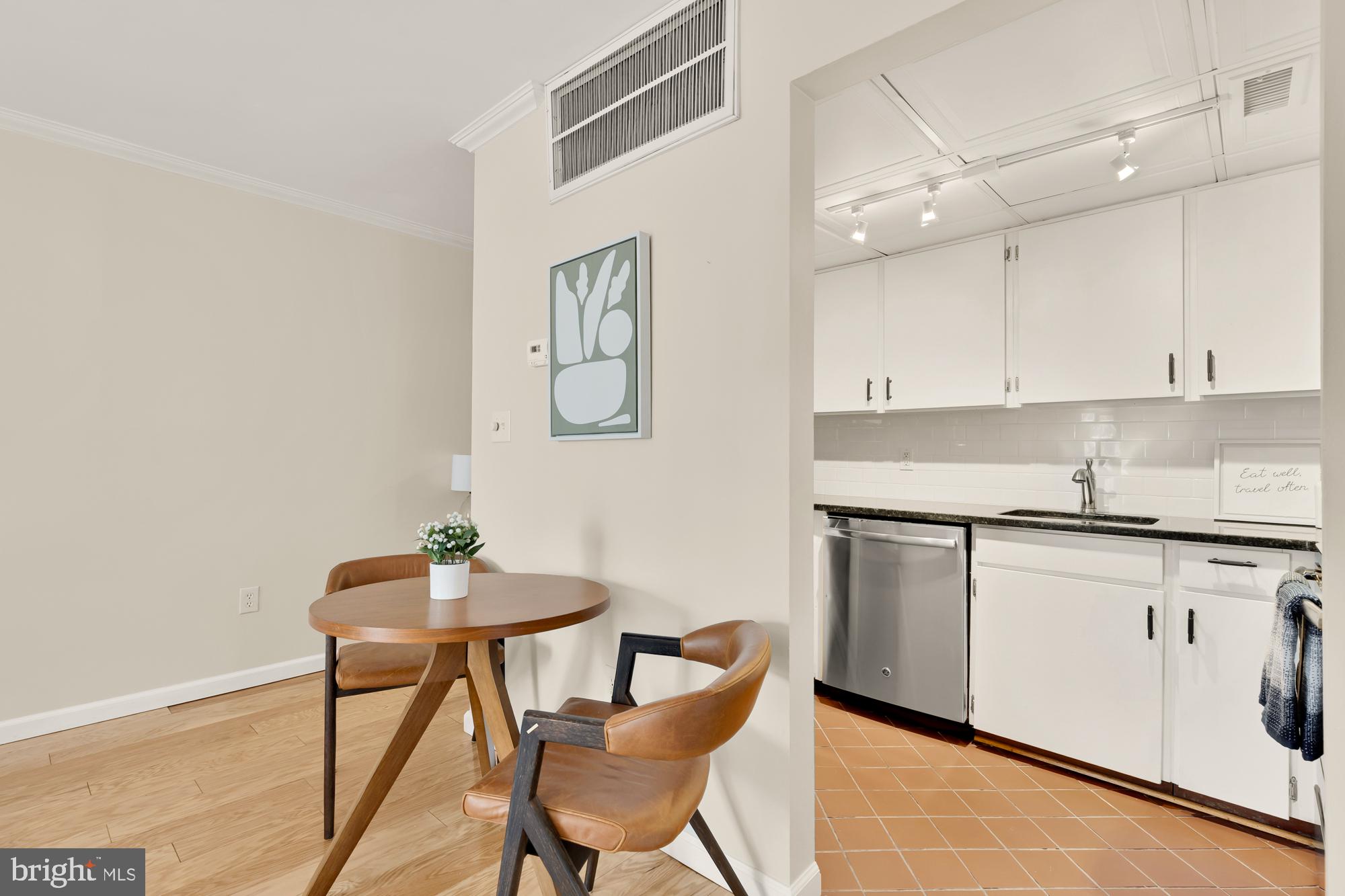 1801 Park Road Northwest, Unit 2 Washington, DC 20010 - Photo 11 of 45 a kitchen with stainless steel appliances granite countertop a sink and cabinets