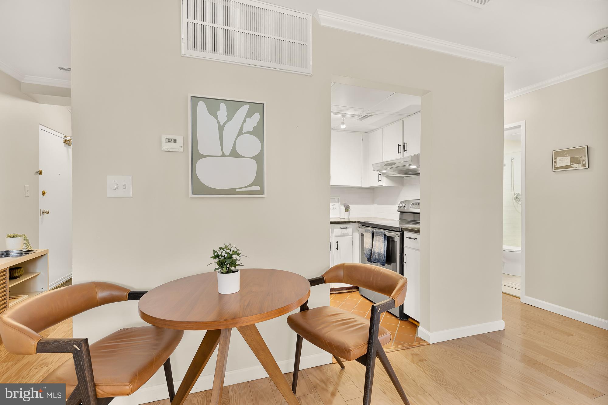 1801 Park Road Northwest, Unit 2 Washington, DC 20010 - Photo 12 of 45 a view of a dining room with furniture and wooden floor